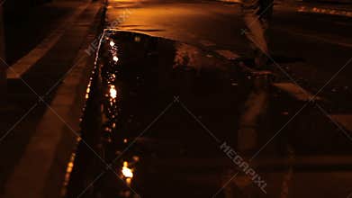 Man Walking on Rainy Night