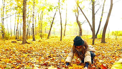 Brunette girl in autumn park