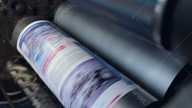 Printing machine passes paper through cylinders