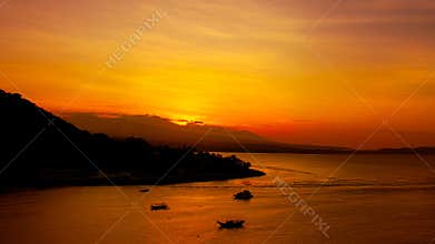 Golden Evening Sky Above Quiet Island Coastline