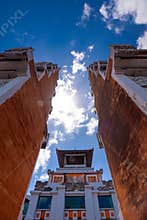 Looking Up Between Traditional Red Brick Temple Walls