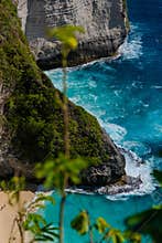 Green Coastal Slope Beside Turquoise Tropical Waters