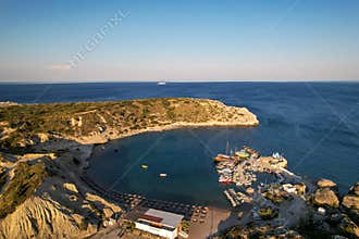Aerial view of Limanaki cove and St. Nicholas chapel in Kolymbia, Rhodes island, Greece.