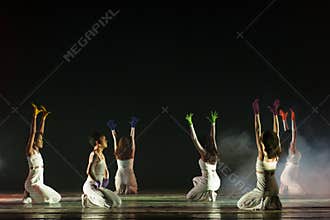 Contemporary Dance Formation With Smoke and Raised Hands