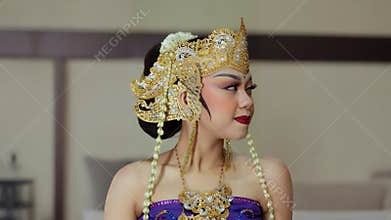 Side Profile Portrait of Woman in Traditional Golden Headdress
