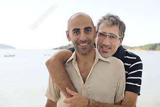 Gay couple on vacation holding hands