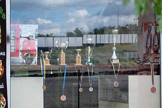 Motorcycle Competition Trophies Displayed In Cafe Window