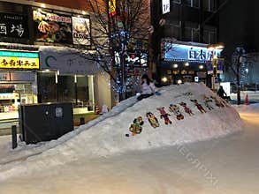A street scene of snow slider at Asahikawa, Japan