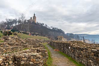 VELIKO TARNOVO, BULGARIA - MARCH 15, 2022: Archaeological site ruins and grassy hill inside Tsarevets Fortress