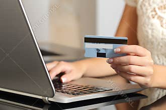 Woman buying online with a credit card ecommerce
