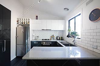 New black and white contemporary kitchen with subway tiles