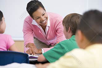 Elementary school teacher with pupils