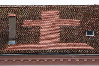 Cross Made from Tiles on a Church Roof