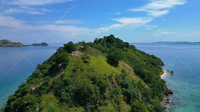 Komodo island paradise beach, jetty, turquoise ocean. Dramatic aerial view drone