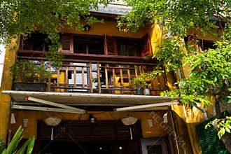Historic Yellow Building with Wooden Balcony in Hoi An Ancient Town, Vietnam