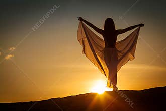 Beautiful woman posing at sunset