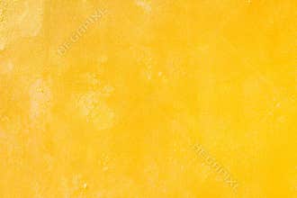 Yellow grunge cement wall, textured background