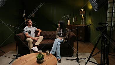 Influencers recording a podcast in a professional studio