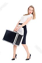 Charming young woman carries a suitcase