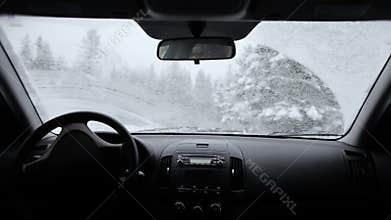 Fast Car Wipers During a Snowstorm