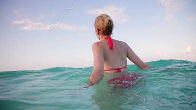 Girl in Vacation Walking in the Ocean
