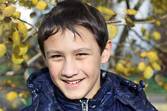 Boy at fall background