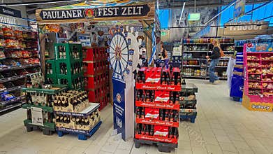 UBERLINGEN, GERMANY - SEPTEMBER 30, 2026: Retail display featuring Ferris wheel decoration, Paulaner tent arch, and
