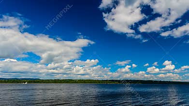 Summer Clouds Rolling Down The River.