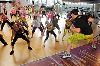 People dancing during Zumba training fitness at a gym