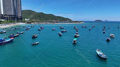 Aerial view of Ana Marina Nha Trang. Wooden fishing boats in a blue sea. Northern part of city, central Vietnam