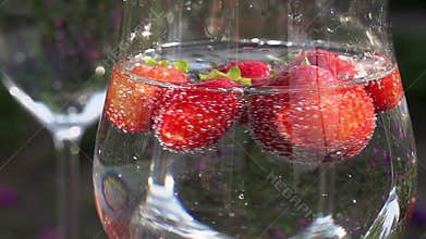 Strawberry Rotates in a Glass with Water