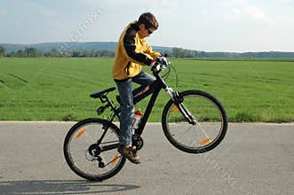 Acrobat on bicycle