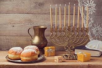 Jewish holiday Hanukkah celebration with vintage menorah