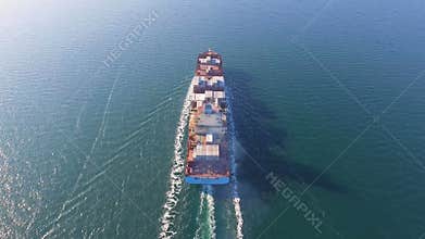 Aerial view of container ship floats in the ocean after loading in port of China
