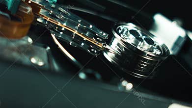 Hard Disk Drive Close-Up Details. HDD head working on rotating magnetic surface. Hard Disk Drive is a data storage