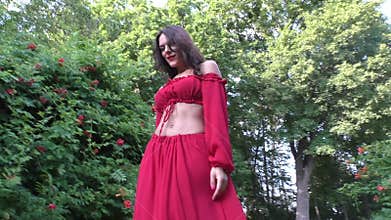 Woman walks beautifully through the park.