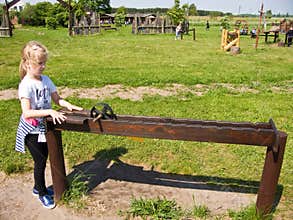 Girl and educational toy outdoors