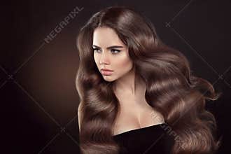 Healthy hair. Wavy hairstyle. Beautiful brunette woman model wit