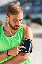 Man using smartphone on armband