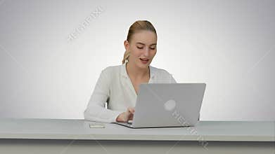 Woman enjoy a good day at job place, dancing and singing on white background.