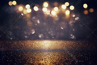 glitter vintage lights background. gold and black