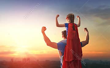 Dad and his daughter playing outdoors