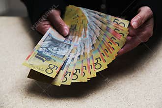 Counting Australian 50 dollar bills