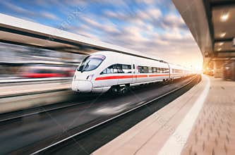 White modern high speed train in motion