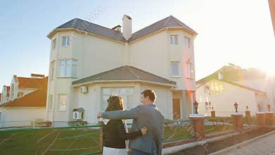 Happy family look at new house