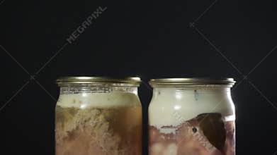 2 beef stew in a transparent jar, camera moves from top to bottom