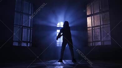 Dancer performing and practicing contemporary, modern dance. Silhouette, slow motion