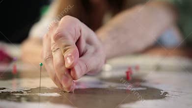 Male hand with pin on the map aiming destination