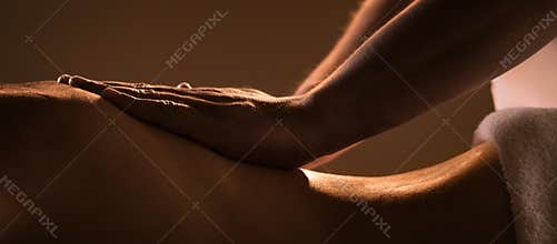 Massage closeup with hands of professional masseur