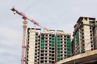 Construction site view of crane, lift, metal beam, brick, metal ladder and concrete